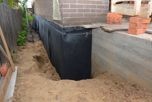 SJ Waterproofing Pros technician performing targeted Interior Drainage System assessment in Mount Pleasant, WI